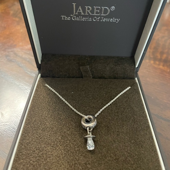 Silver necklace with a circle at end and pacifier at end of circle - Picture 6 of 6